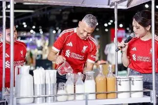 A person and person pouring milk into a glass AI-generated content may be incorrect.