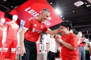 A person and child in red shirts AI-generated content may be incorrect.